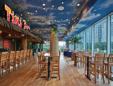 Tiki bar interior with tables and chairs